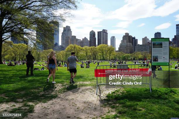 People fill Sheep Meadow in Central Park during the coronavirus pandemic on May 2, 2020 in New York City. COVID-19 has spread to most countries...