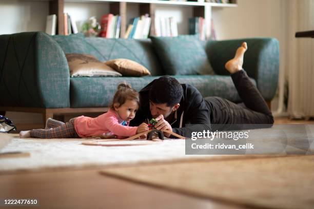 spending quality playtime with father - child train set stock pictures, royalty-free photos & images