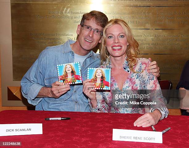 Actors Dick Scanlan and Sherie Rene Scott sign cd's at the "Everyday Rapture" original cast recording signing at the American Airlines Theatre on...