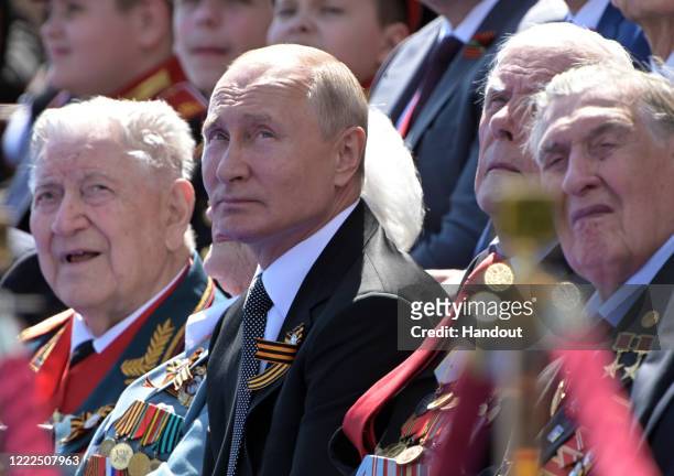 President of Russia and Commander-in-Chief of the Armed Forces Vladimir Putin watches a Victory Day military parade marking the 75th anniversary of...