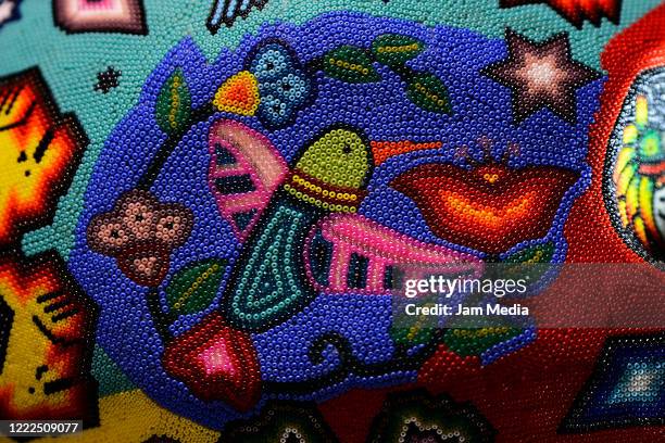 Detail of birds in a skull made of Huichol handicraft on May 01, 2020 in Mexico City, Mexico. Villanueva is known for his efforts to keep and...