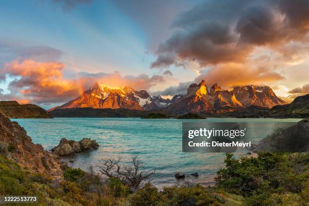 sunrise with rainbow in the patagonian andes mountains - torres del paine national park stock pictures, royalty-free photos & images
