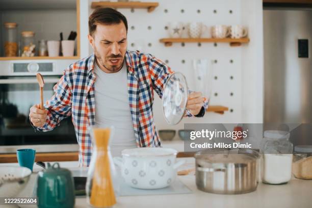 failed cooking in kitchen stock photo - burnt cooking stock pictures, royalty-free photos & images