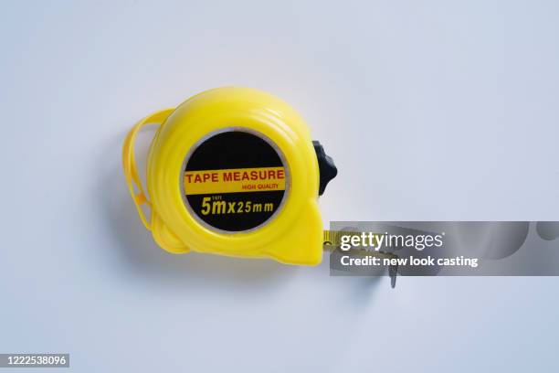 metal measuring tape - metric system stock pictures, royalty-free photos & images