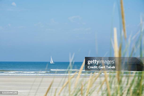 beach and blue sea - vlieland stock pictures, royalty-free photos & images