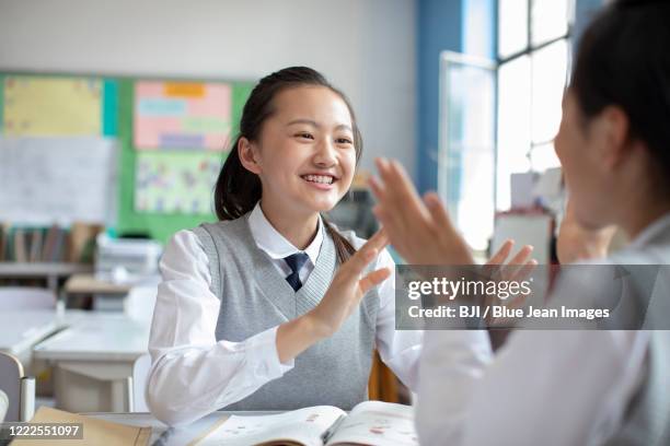 College Kids Having Fun On Campus Photos and Premium High Res Pictures ...