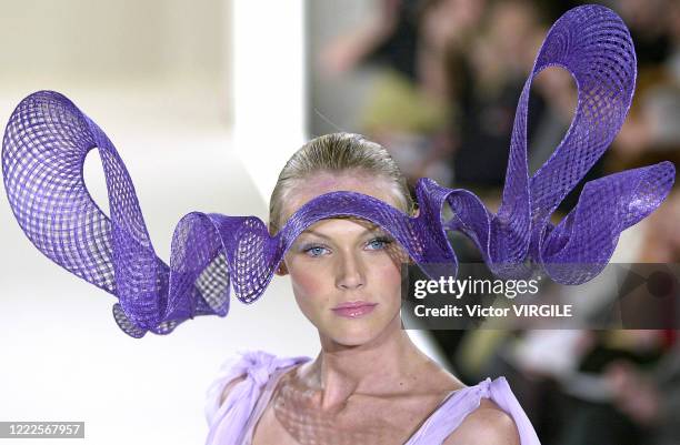 Model walks the runway during the Philip Treacy Haute Couture Spring/Summer 2000 fashion show as part of the Paris Haute Couture Fashion Week on...