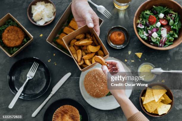 sharing takeaway fast-food meal - lunch top view stock pictures, royalty-free photos & images