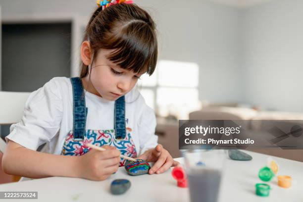 little girl is  doing activity at home - love on the rocks stock pictures, royalty-free photos & images