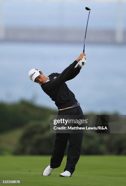 Goncalo Pinto of the Continent of Europe plays a shot from the fairway during their Foursome match against David Boote of Great Britain and Ireland...