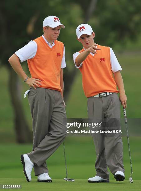 Natham Kimsey and Harrison Greenberry of Great Britain and Ireland look on during their Foursome match against Maximilian Rottluff and Robin Goger of...