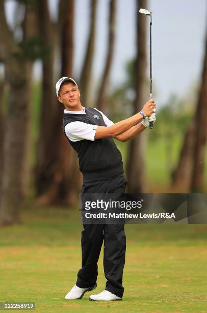 Robin Goger of the Continent of Europe plays a shot from the fairway during their Foursome match against Nathan Kimsey and Harrison Grenberry of...