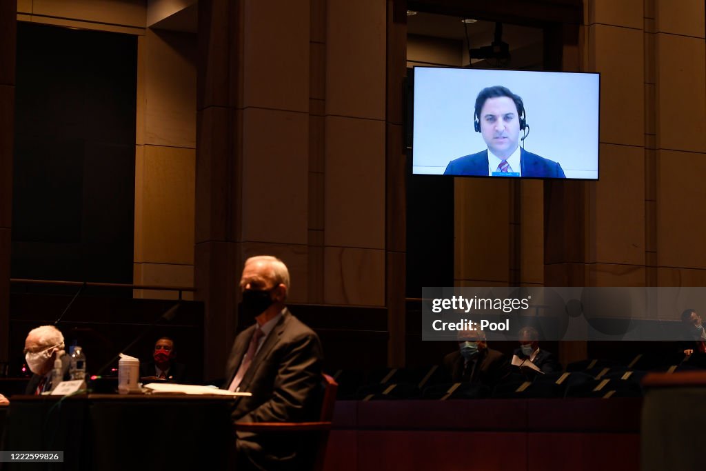 Aaron Zelinsky, on screen, a career Justice Department prosecutor who