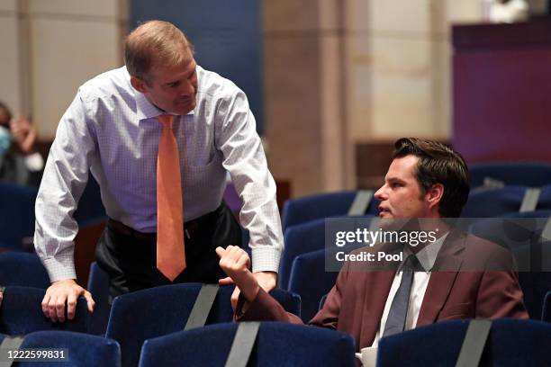 Rep. Jim Jordan left, talks with Rep. Matt Gaetz before the start of a House Judiciary Committee hearing on oversight of the Justice Department and a...