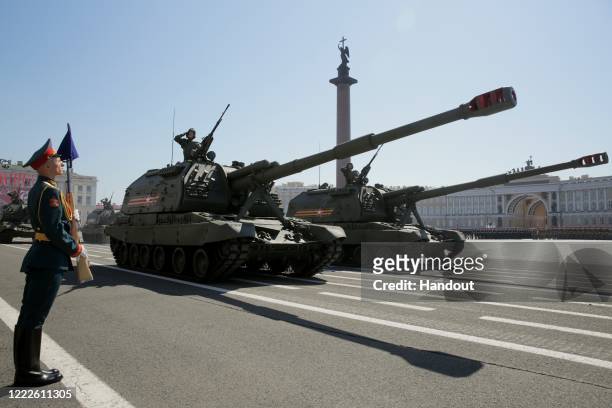 Military equipment drives along Palace Square during a Victory Day military parade, marking the 75th anniversary of the victory in World War II, on...