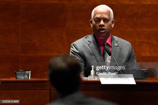 Rep. Hank Johnson asks a question of John Elias, a career official in the Justice Departments antitrust division, during a House Judiciary Committee...