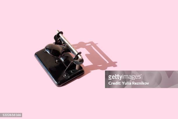 hole puncher on the pink background - punching stock pictures, royalty-free photos & images