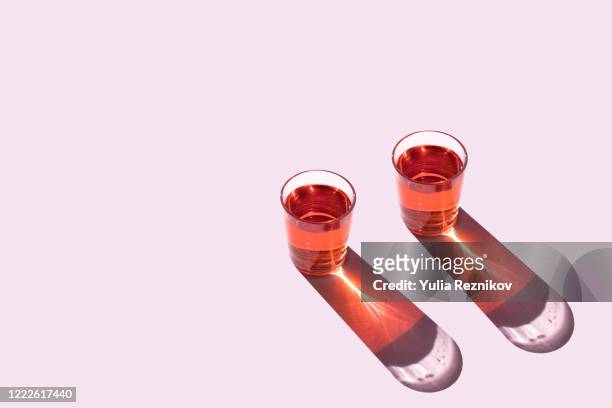 top view of two glasses on the pink background - alcohol top view bildbanksfoton och bilder