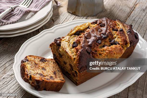 banana bread with chocolate chips - banana loaf stock pictures, royalty-free photos & images