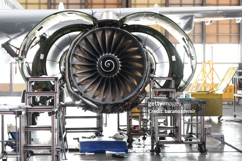 Aircraft Jet engine maintenance in airplane hangar
