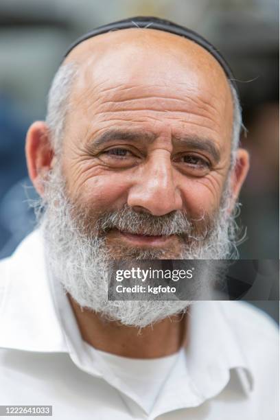 israeli jewish senior man portrait with yarmulke looking at the camera in jerusalem old city, israel - yarmulke stock pictures, royalty-free photos & images