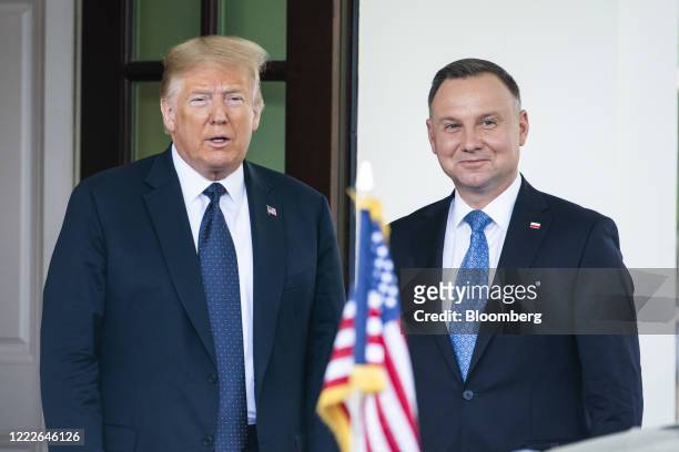 President Donald Trump, left, and Andrzej Duda, Poland's president, stand for photographers at the West Wing of the White House in Washington, D.C.,...