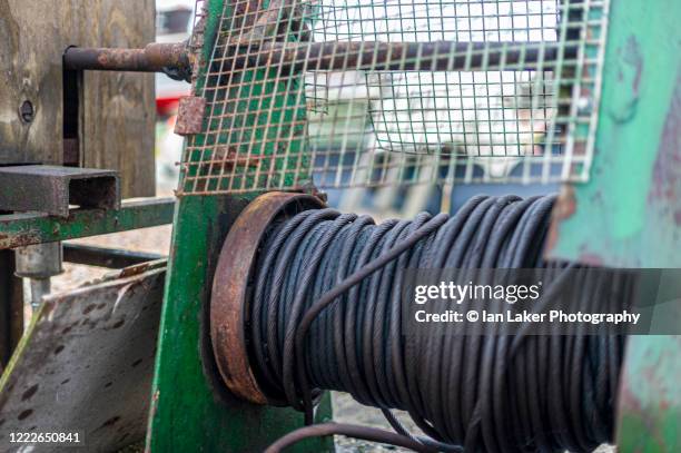 deal, kent, england, united kingdom. 26 december 2011. winch gear and detail of fishing-related equipment on deal beach. - cable pulley wheels stock pictures, royalty-free photos & images