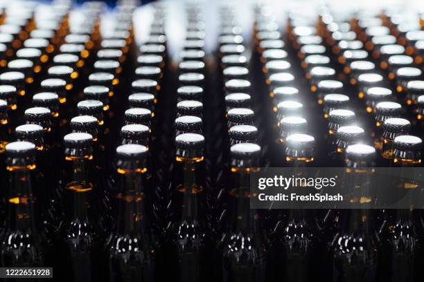 beer bottles in close up - microbrewery stock pictures, royalty-free photos & images