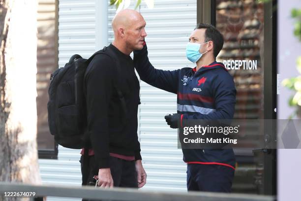 Roosters assistant coach Craig Fitzgibbon has his temperature checked whilst arriving at Sydney Roosters headquarters on May 04, 2020 in Sydney,...