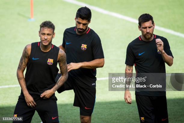 Lionel Messi of Barcelona and Neymar of Barcelona and Luis Suarez of Barcelona warm up during the International Champions Cup Barcelona training...