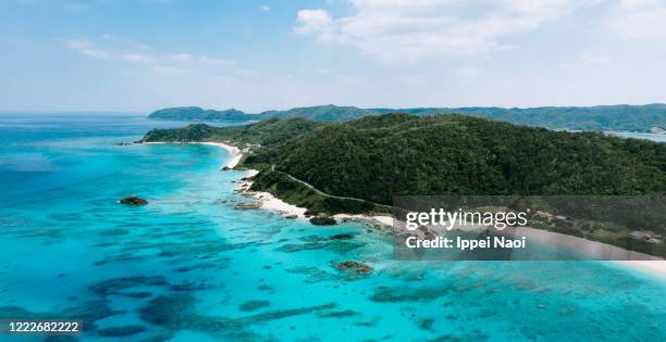 aerial view of tropical coastline with turquoise water, amami oshima, japan - okinawa aerial stock pictures, royalty-free photos & images