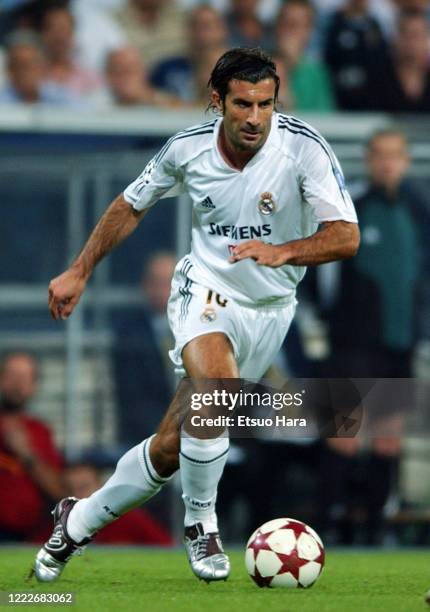 Luis Figo of Real Madrid in action during the UEFA Champions League Group B match between Real Madrid and AS Roma at the Estadio Santiago Bernabeu on...