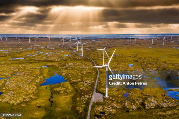 wind generators at sunset. sweden. aerial view. - wind farms stockfoto's en -beelden
