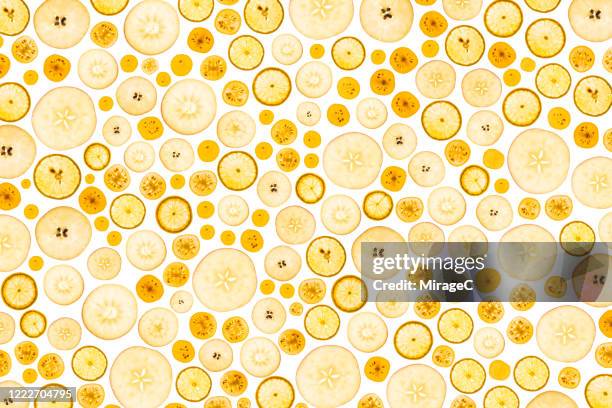 abundance of yellow fruit slices - apple pattern stock-fotos und bilder