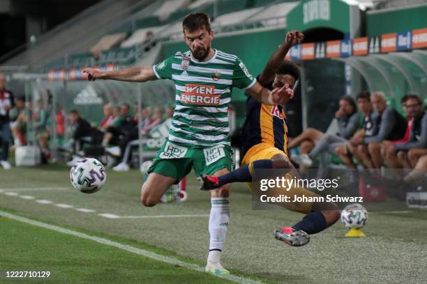 Filip Stojkovic of Rapid and Karim Adeyemi of Salzburg during tipico Bundesliga match between SK Rapid Wien and FC Red Bull Salzburg at Allianz...