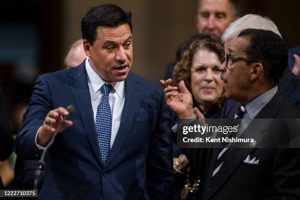 Los Angeles City Council members Jose Huizar and Herb Wesson before the City Council votes on imposing a new fee on development to raise money for...