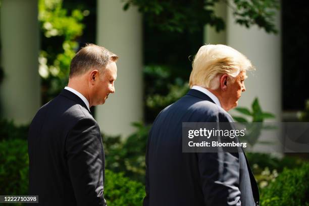 President Donald Trump, right, and Andrzej Duda, Poland's president, exit after a news conference in the Rose Garden of the White House in...