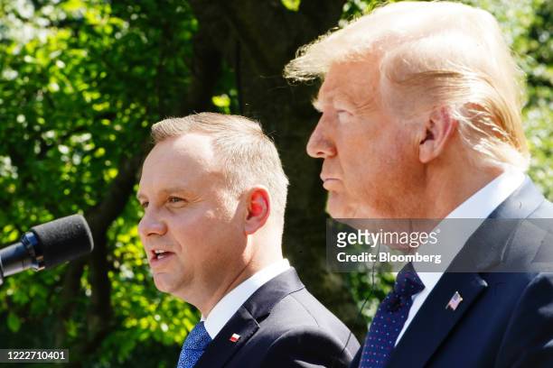 Andrzej Duda, Poland's president, speaks as U.S. President Donald Trump, right, listens during a news conference in the Rose Garden of the White...