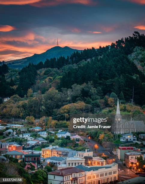 sunset over port chalmers and mount cargill - new zealand city stock pictures, royalty-free photos & images