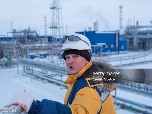 employee of a gas station in the north of russia - russian people stock pictures, royalty-free photos & images