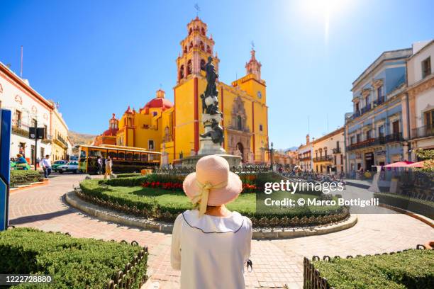 woman admiring the basilica of our lady of guanajuato, mexico - guanajuato stock pictures, royalty-free photos & images