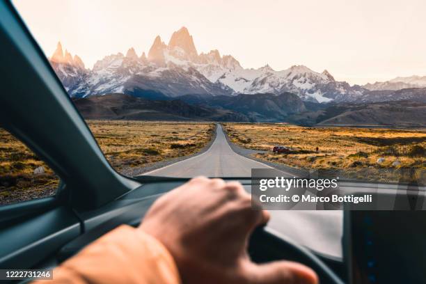 personal perspective of man driving a car in patagonia, argentina - classic car point of view stockfoto's en -beelden