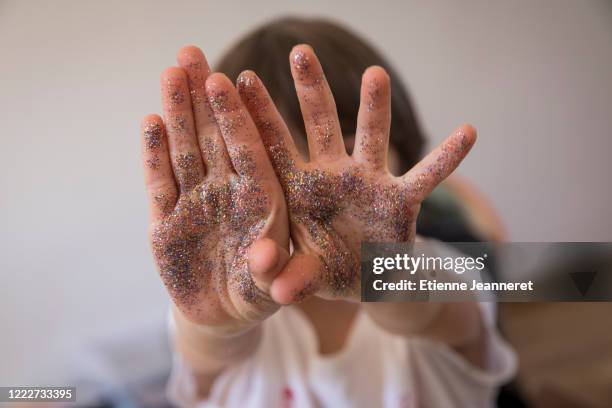 little artist hands, montargis, france. - sparkle children stock pictures, royalty-free photos & images