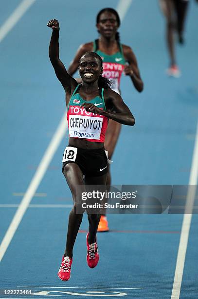 Vivian Jepkemoi Cheruiyot of Kenya celebrates as she crosses the finish line to win the women's 10,000 metres final during day one of the 13th IAAF...