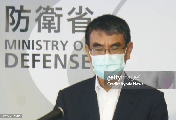 Japanese Defense Minister Taro Kono meets the press in Tokyo on June 25, 2020. Earlier in the day, he said at a meeting of the ruling Liberal...