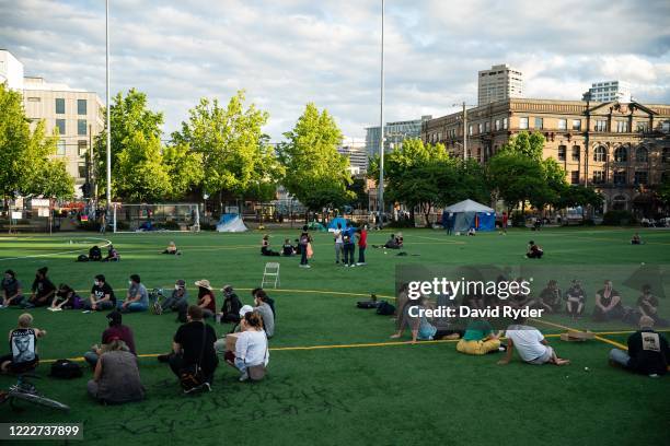 Demonstrators in multiple groups meet in Cal Anderson Park in the area known as the Capitol Hill Organized Protest on June 24, 2020 in Seattle,...