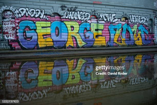 Graffiti bearing the name of George Floyd is seen in Cal Anderson Park in the area known as the Capitol Hill Organized Protest on June 24, 2020 in...