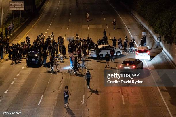 Protesters block Interstate 5 after marching from the area known as the Capitol Hill Organized Protest on June 24, 2020 in Seattle, Washington. On...