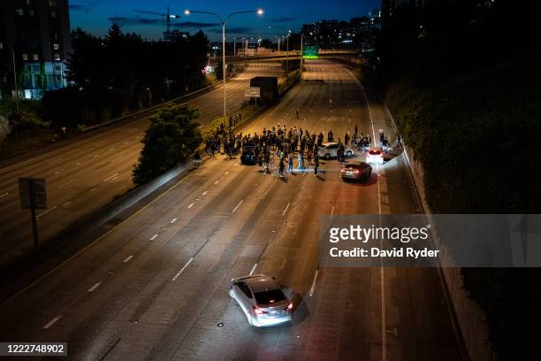 Protesters block Interstate 5 after marching from the area known as the Capitol Hill Organized Protest on June 24, 2020 in Seattle, Washington. On...