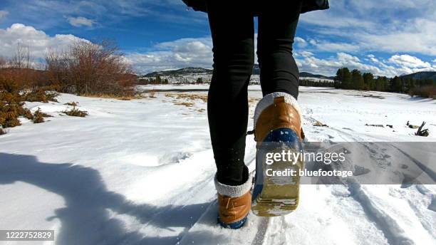 walking on snow with winter boots - sole of shoe stock pictures, royalty-free photos & images